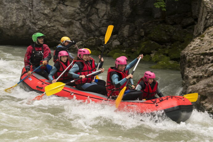 A group of students rafting in Switzerland at a summer camp