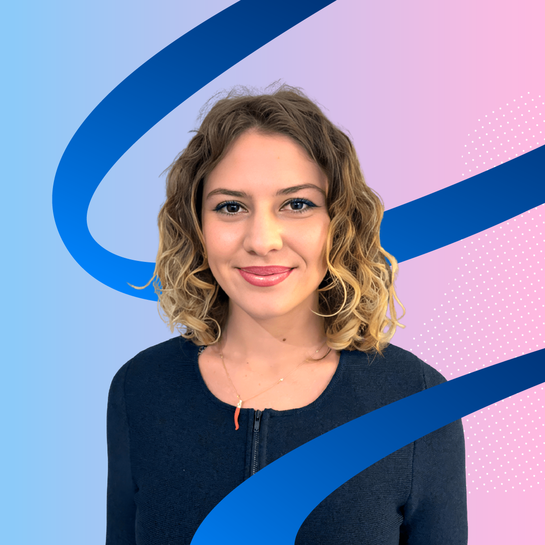 Professional headshot of smiling woman with curly blonde hair on abstract gradient background