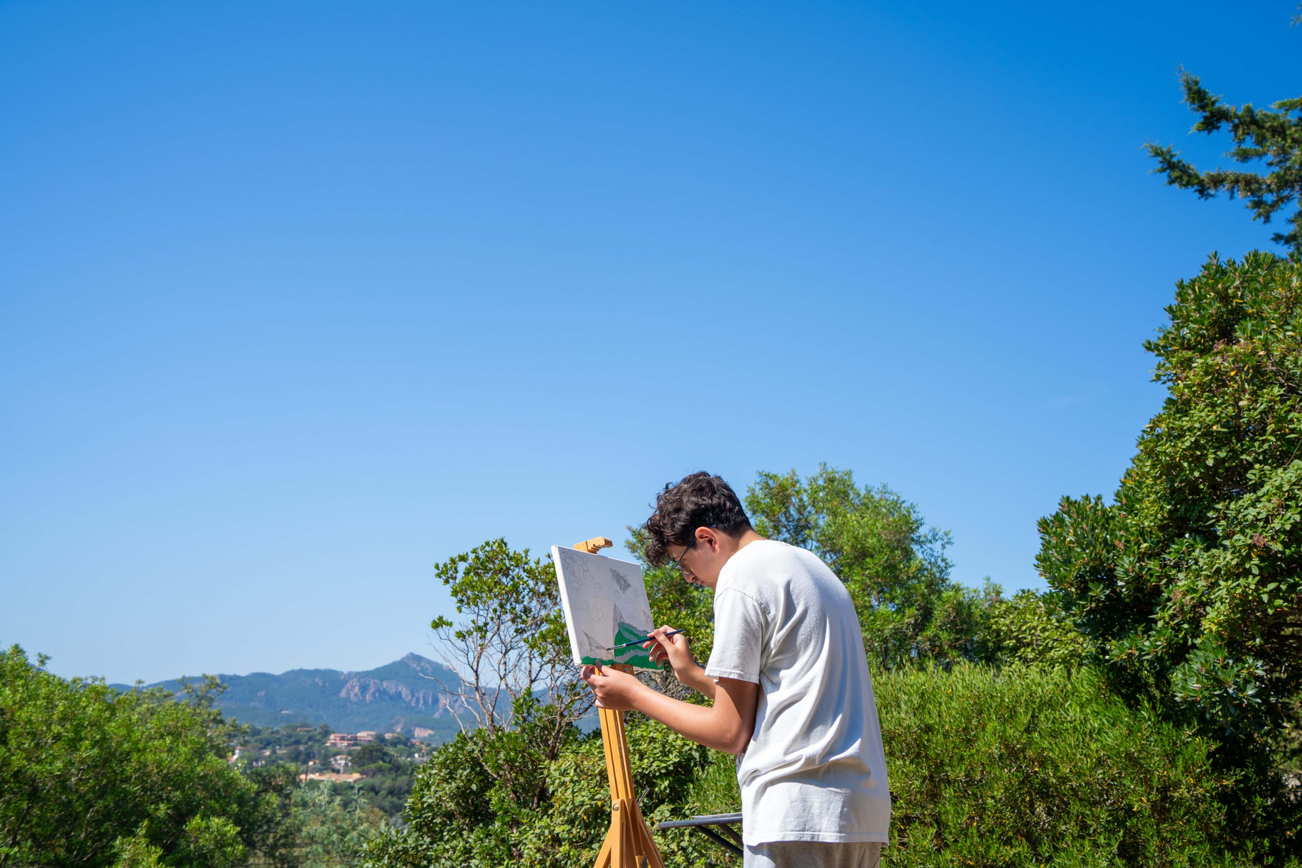 Creative Camp painting on an easel